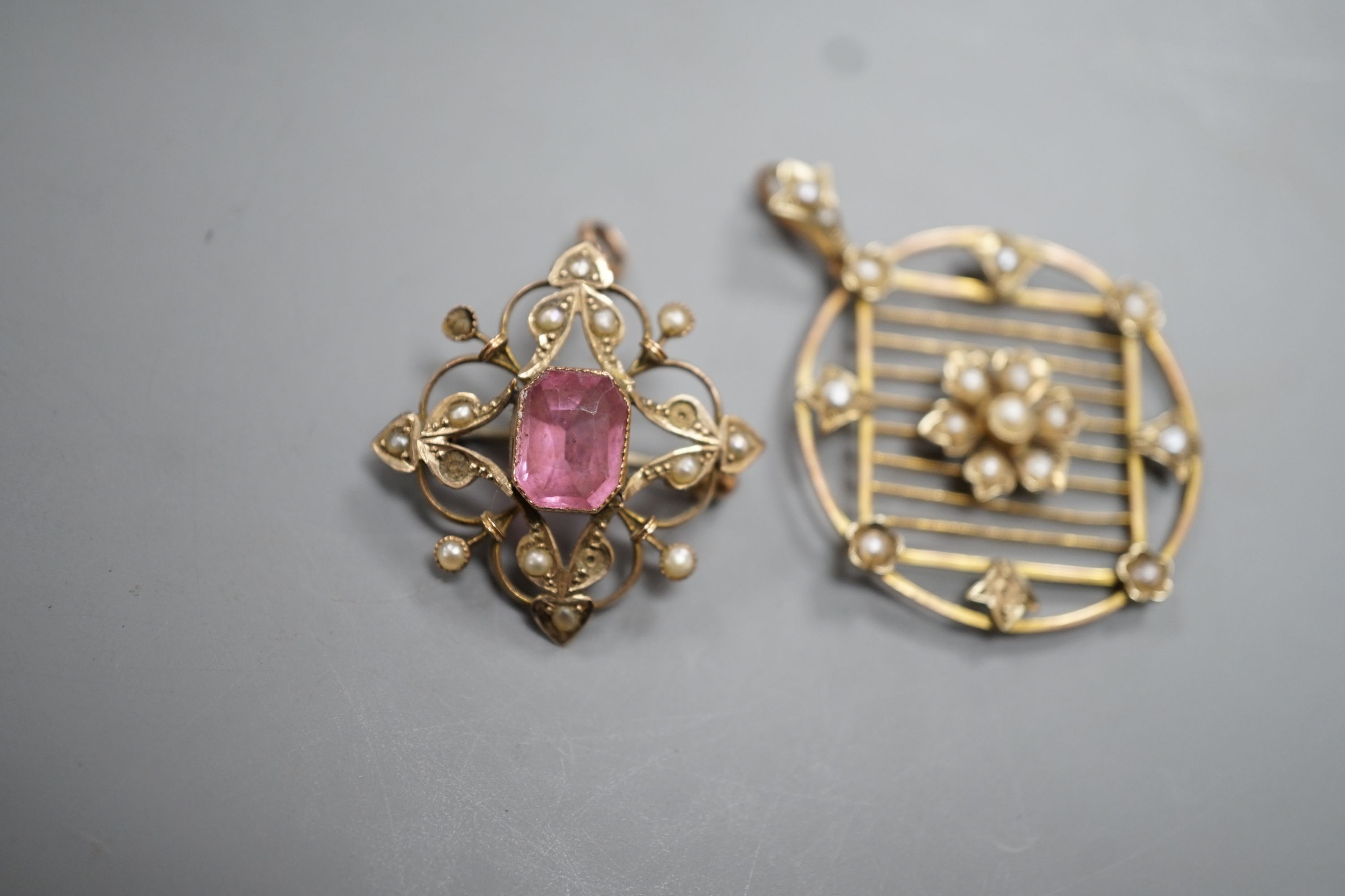 An Edwardian 9ct and seed pearl set circular pendant , 31mm and a similar pink paste and seed pearl set pendant brooch, gross 7.2 grams.